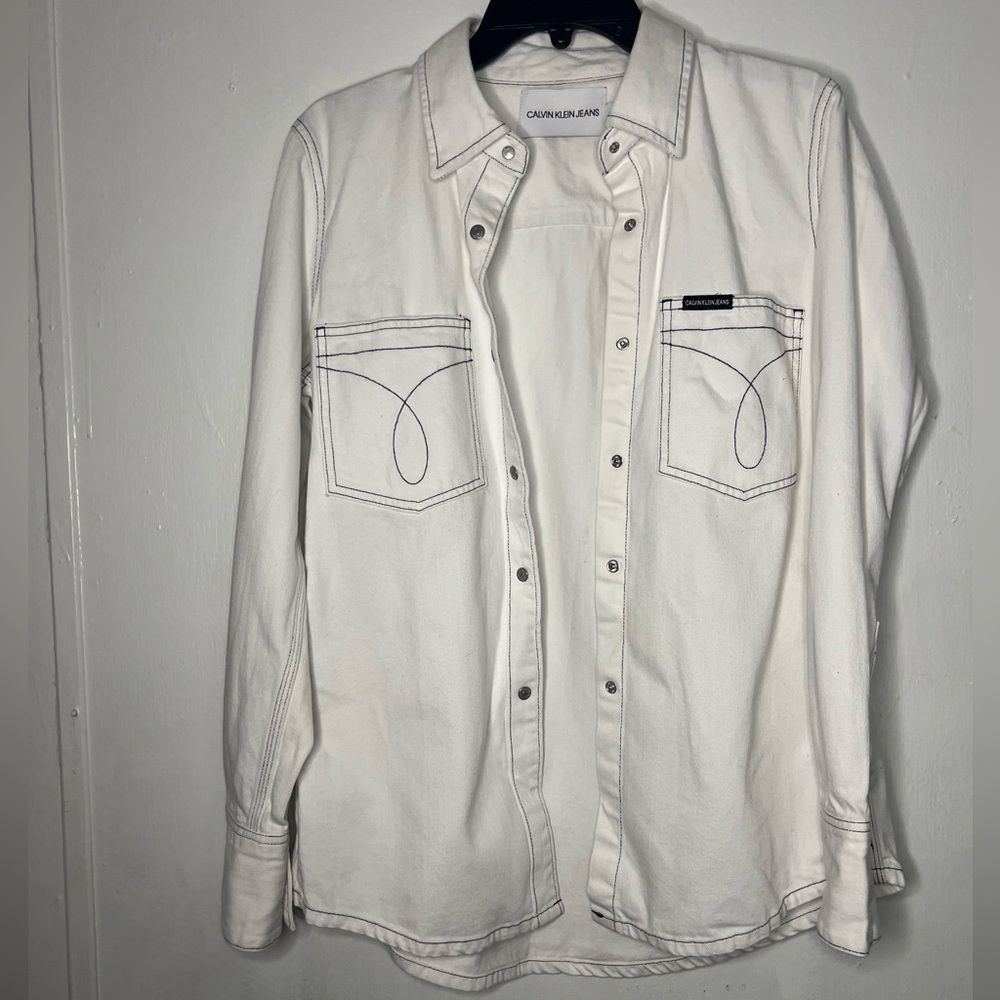 White Calvin Klein, denim shirt, or jacket